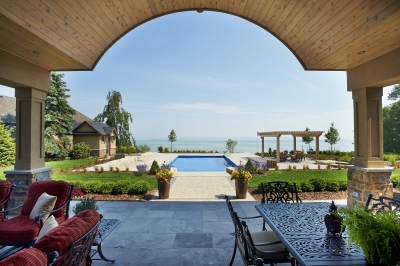 Designs by Santy :: Lakefront Paradise Back porch view with arched ceiling and matching shed