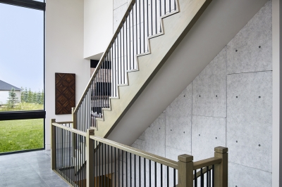 Designs by Santy :: Modern Prairie staircase with large window, wood concrete finish