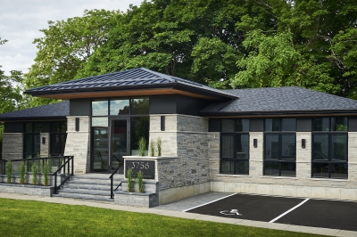 Designs by Santy :: Ravine Office Front exterior with prairie roof and tapered buttresses
