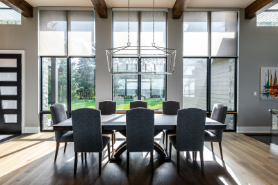 Designs by Santy :: Modern Lakehouse Dining room with modern window grills, transom and wood beams