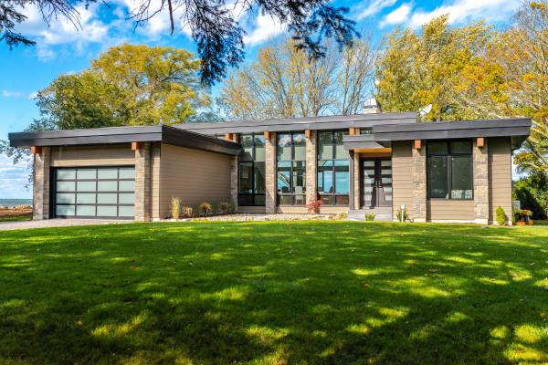 Designs by Santy :: Modern Lakehouse Front exterior modern with stone, black trim and wood beams