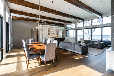 Designs by Santy :: Modern Lakehouse Open concept dining area view to kitchen and great room with wood beams and lake view