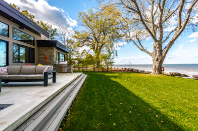 Designs by Santy :: Modern Lakehouse Rear exterior with patio and lake view