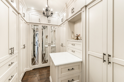 Designs by Santy :: Traditional Luxury Walk in closet with millwork and chandelier