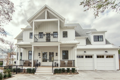 Designs by Santy :: Coastal Farmhouse Front exterior with board and batten, metal roof, porch and balcony