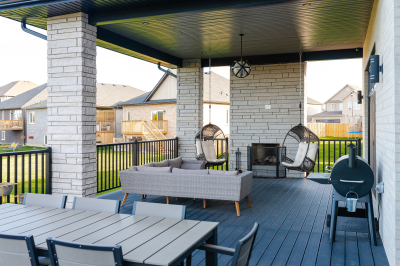 Designs by Santy :: Modern Pilaster Home Covered deck with rectangular stone columns and outdoor fireplace